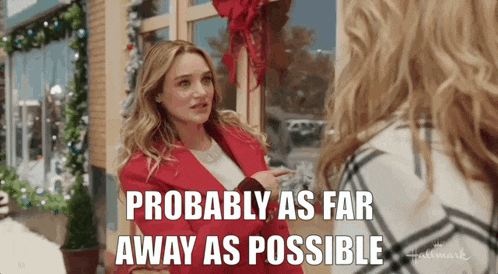 a woman in a red jacket is talking to another woman in a hallmark movie .