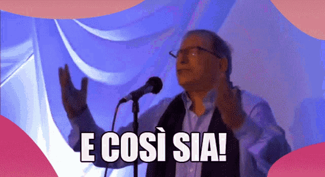 a man stands in front of a microphone with the words e così sia written below him