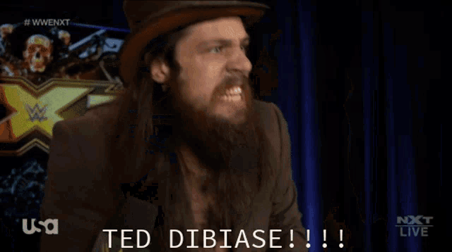 a man with a beard is holding a piece of paper that says ted dibiase !!!
