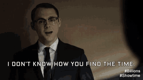 a man in a suit and tie says i don t know how you find the time