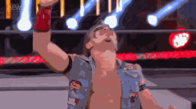 a man in a wrestling ring with the word aew on the bottom right