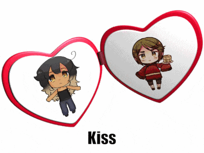 a couple of heart shaped mirrors with the word kiss on the bottom right