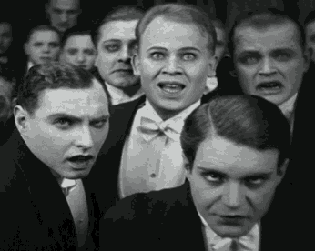 a group of men in tuxedos and bow ties are making funny faces