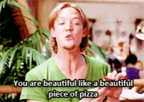 a man in a green shirt is saying " you are beautiful like a beautiful piece of pizza "