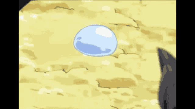 a cartoon drawing of a blue blob with chinese writing on it 's face