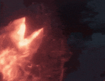 a close up of a red fireball in the dark .