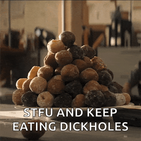 a pile of donuts on a plate with the words stfu and keep eating dickholes below it