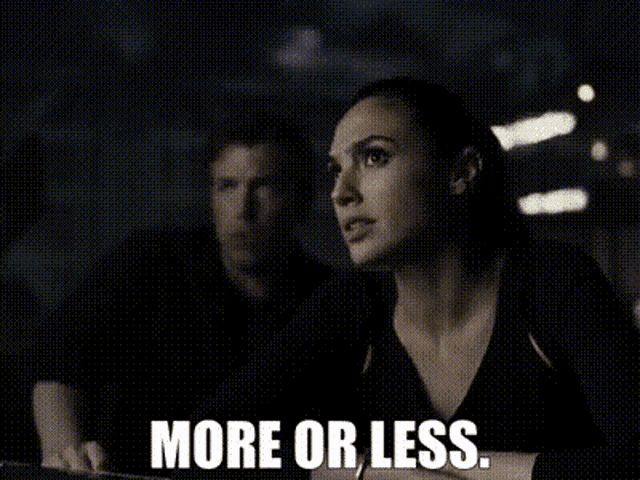 a woman is sitting next to a man in a dark room with the words `` more or less '' written above her .