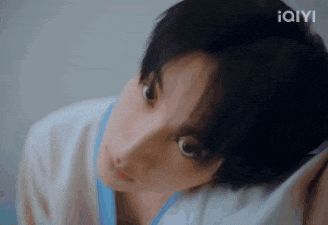 a close up of a person 's face with a blurred background .
