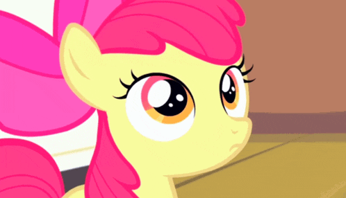 a close up of a pony with a pink mane
