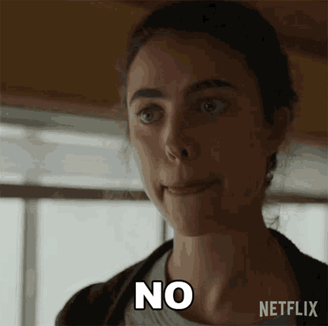 a woman is making a face and says no in white letters