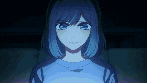 a girl with blue hair and a blue shirt is looking at the camera