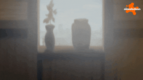 a blurry picture of a window with a nickelodeon logo