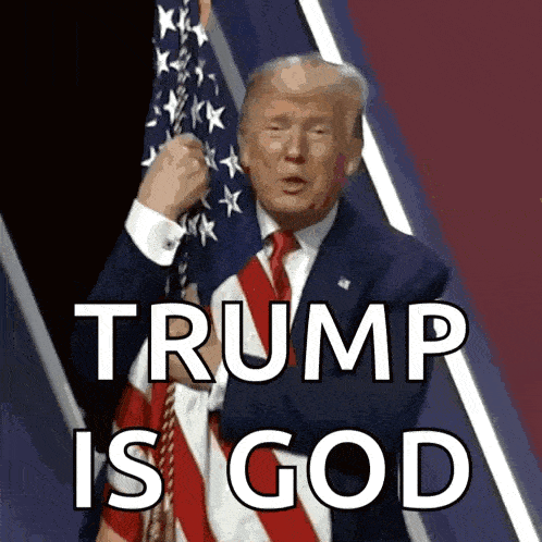 a man in a suit and tie holding an american flag with the words trump is god above him