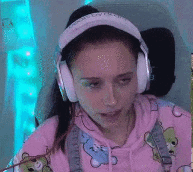 a woman wearing headphones with the word beats by dre on them