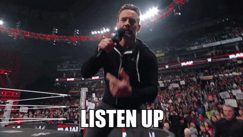 a man holding a microphone in front of a crowd with the words listen up above him