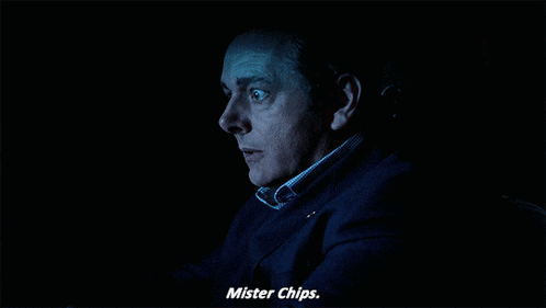 a man in a suit says mister chips on the screen