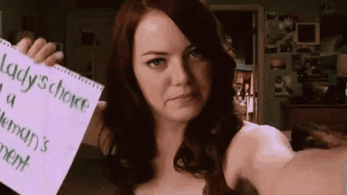 a woman is taking a selfie while holding a sign that says lady 's choice
