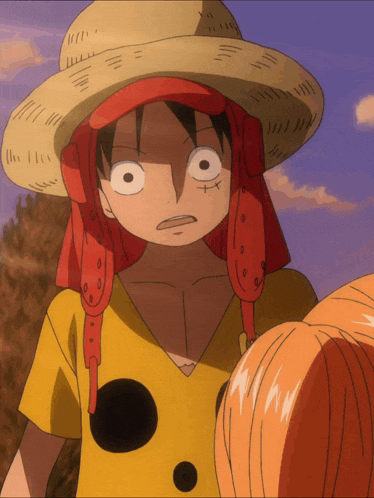 luffy from one piece is wearing a straw hat and yellow shirt