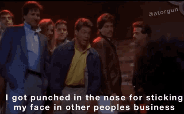 a group of men are dancing and one of them says i got punched in the nose for sticking