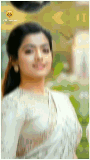 a blurry picture of a woman with the words vm creation on the bottom left