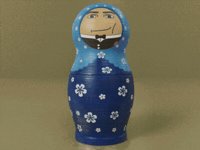 a green doll with a picture of a man on its head