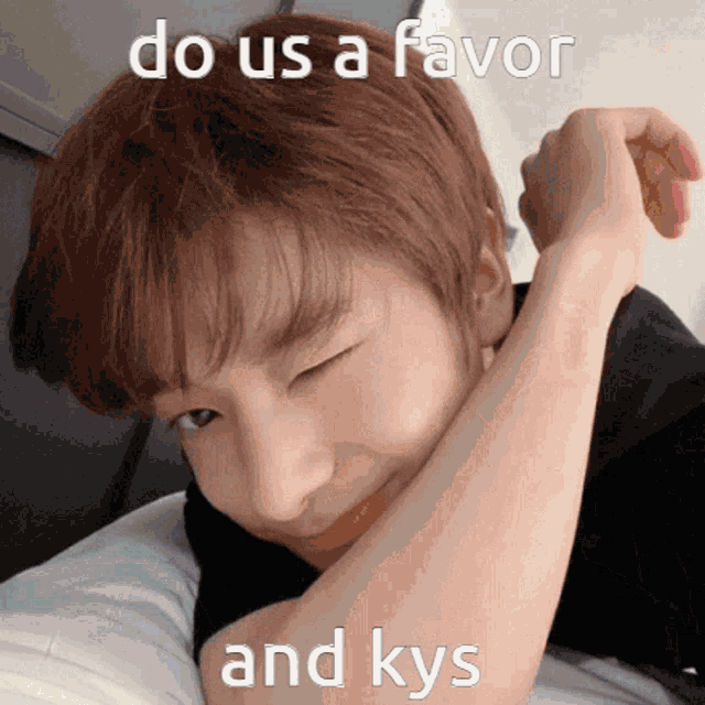 a young man is laying on a bed with his eyes closed and a meme that says do us a favor and kys