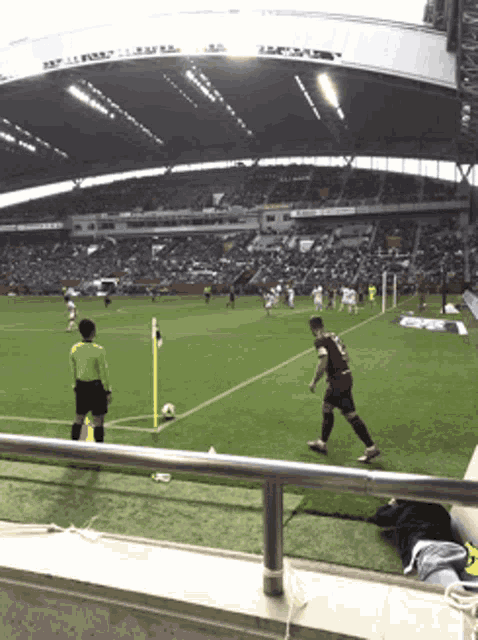 a soccer game is being played in a stadium with a banner that says ' allianz ' on it
