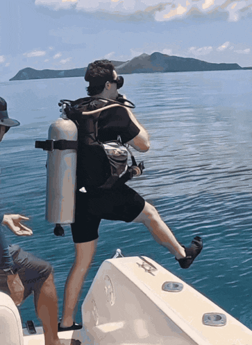 a scuba diver getting ready to dive into the water