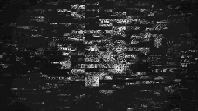 a black and white image of a man 's face made up of letters and numbers