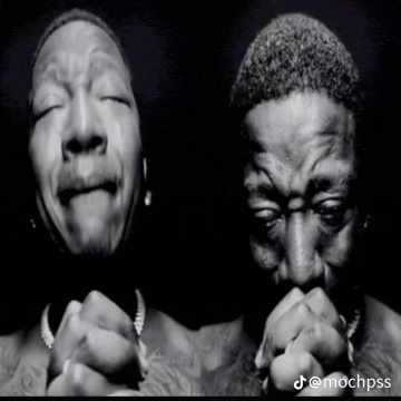 a black and white photo of a man with his eyes closed