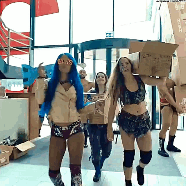 a woman with blue hair is wearing sunglasses that say ' sasha banks '