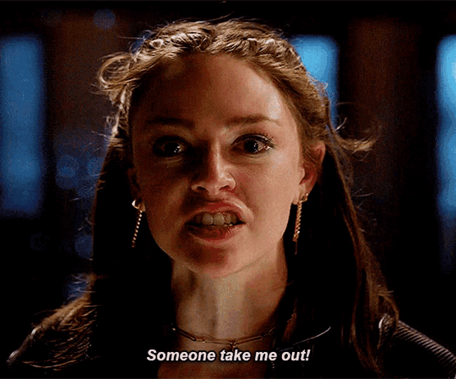 a woman is making a funny face and saying someone take me out