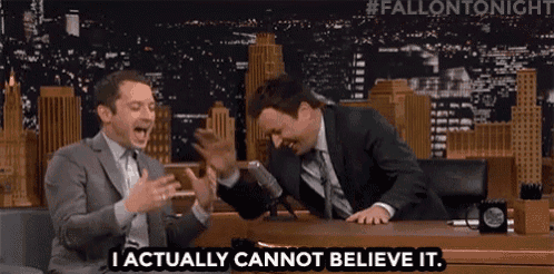 two men are sitting at a table laughing and one of them says i actually cannot believe it .