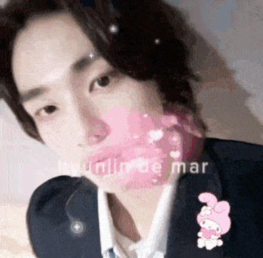 a close up of a person 's face with the name hyunjin de mar written on it