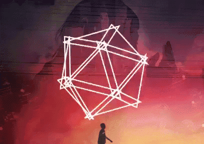 a silhouette of a person standing in front of a large geometric shape
