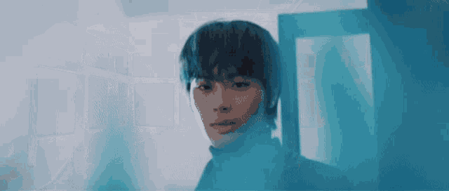 a man is standing in a doorway with a blue smoke coming out of it .