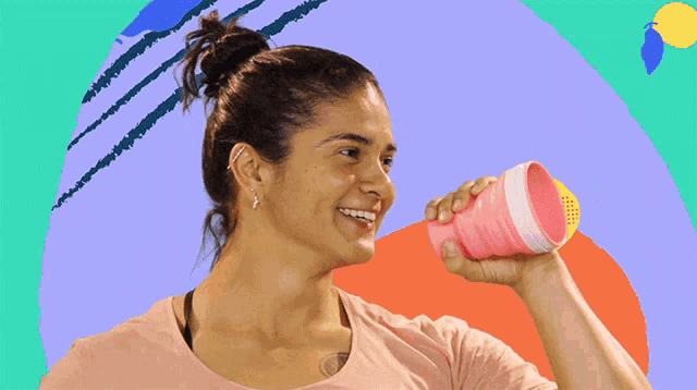 a woman drinking from a pink cup with the words eu te amoooo on the top