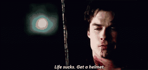 a man with blood on his face is saying `` life sucks . get a helmet '' .