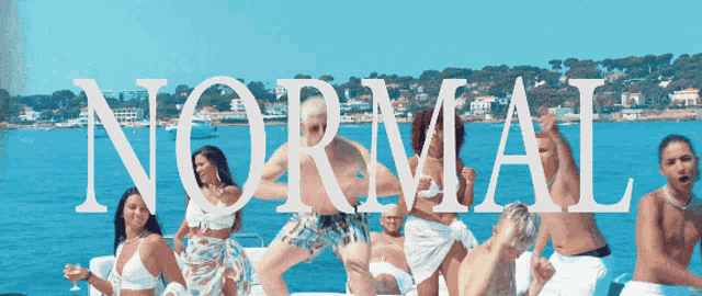 a group of people on a boat with the word normal written in white letters