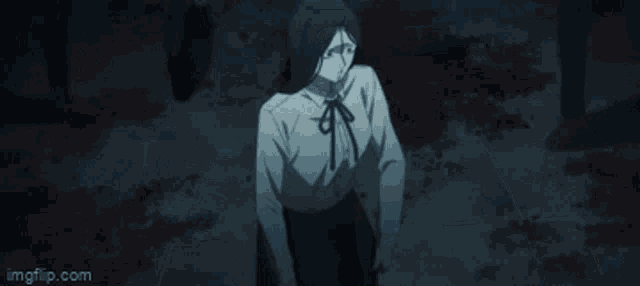 a girl in a white shirt and black skirt is standing in a dark room surrounded by people .