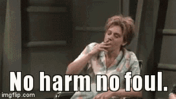 a woman is sitting in a wheelchair smoking a cigarette and says `` no harm no foul '' .