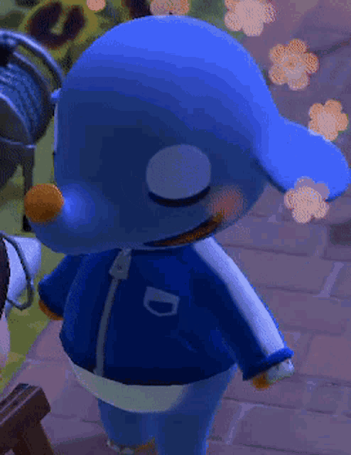 a blue animal with the letter d on his jacket