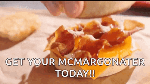 a close up of a sandwich with the words get your mcmargonator today