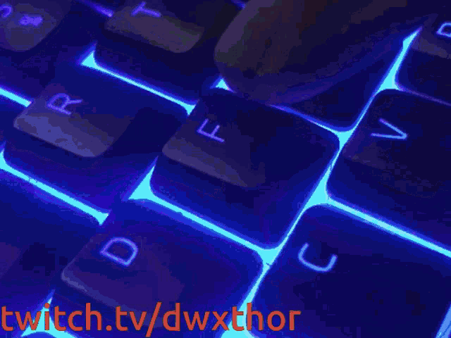 a computer keyboard with the words twitch.tv/dwxthor in red