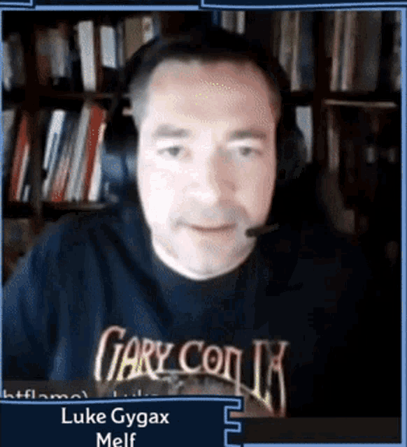 a man wearing headphones is wearing a shirt that says gary con