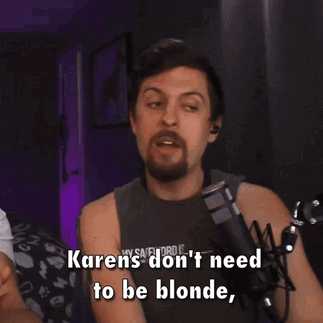 a man talking into a microphone with the words " they just need to be ignorant as f * ck " below him