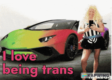 a woman standing in front of a rainbow car with the words i love being trans