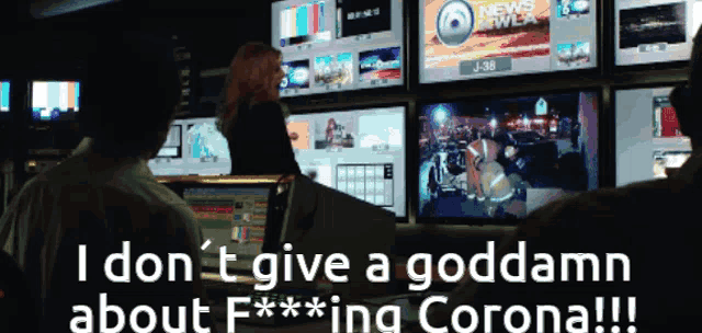 a tv screen shows a fireman and the words i don t give a goddamn about f *** ing corona