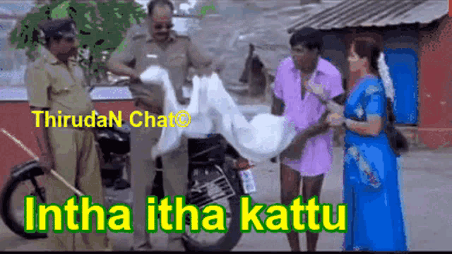 a group of people standing in front of a motorcycle with the words " itha itha kattu " on the bottom right